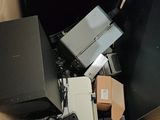a cardboard box full of electronic devices and electronics