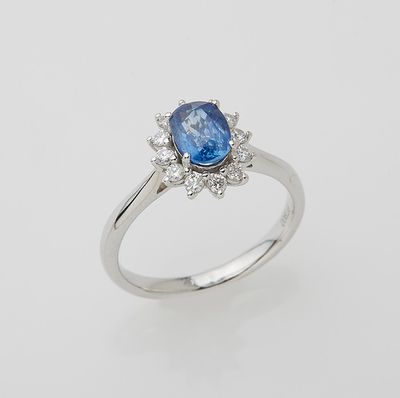 an oval blue sapphire and diamond ring