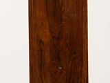 a small wooden clock that is on a table