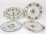 three plates with different designs on them sitting next to each other