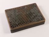 brown and black box on a white surface with a pattern