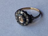 a close up of a ring with a stone in it