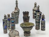 a lot of silver objects that are on a table
