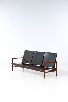 an image of two black leather seats on a white surface