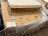 a lot of boxes of wood on the floor in a warehouse