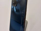 a close up of a phone on a stand on a table