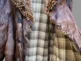 an image of a coat with a fur collar on a mannequin