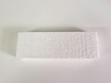 a white piece of paper on top of a toilet seat