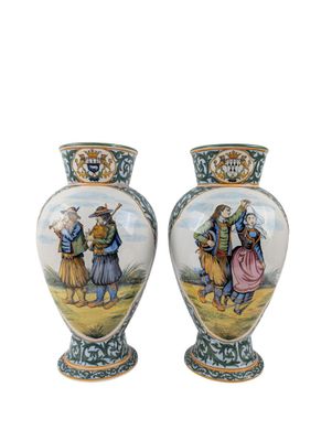 two vases with a painting of a man and a woman on them