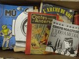 many books in a box that are sitting on top of each other