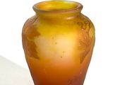 a vase that is sitting on a table with a white background