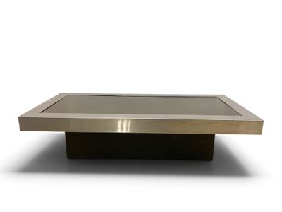 une image d'une table basse avec un plateau en verre