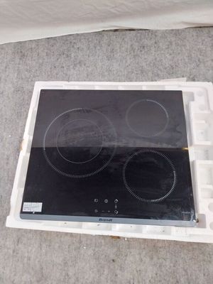 une plaque de cuisson blanche équipée de deux feux