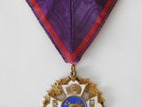 a close up of a medal with a ribbon around it