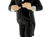 a figurine of a man in a tuxedo
