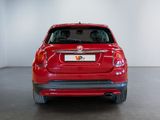 the back end of a red car in a white room