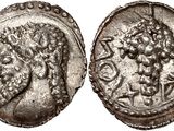 une pièce d'argent portant l'image d'un homme