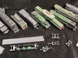 a lot of toy trains that are sitting on a table