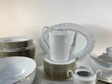 a lot of plates and cups on the table