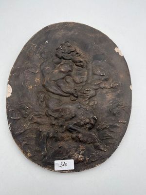 an image of a bronze plaque with a woman on it