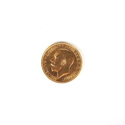 une pièce d'or sur laquelle figure le visage d'un homme
