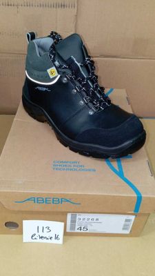 a box with a pair of black boots on it