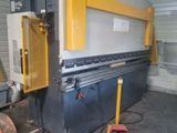 an image of a machine that is in a garage