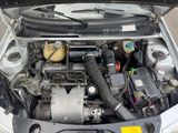a car engine with its hood open on the street