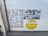 a sign on the door of a building that says max 750 kg