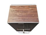 a wooden box with a metal handle on a white background