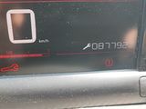 a close up of a car ' s dashboard with a clock on it