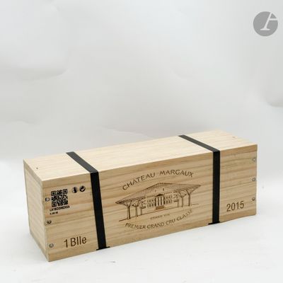 a wooden box with a wine label on it sitting on a white surface