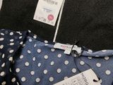 a pile of clothing with a price tag on it