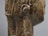 sculpture of a woman ' s head with a veil on her head