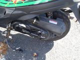 a close up of a motor scooter parked on the street