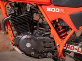a close up of a red motorcycle with a black seat