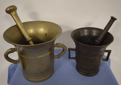 two different types of mortars on a blue cloth