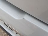 a close up of the front bumper of a white car