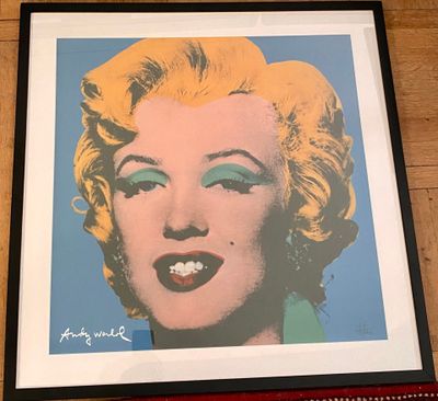 framed photograph of marilyn monroe with blue eyes and yellow hair