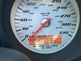 a close up of a speedometer on the dashboard of a car