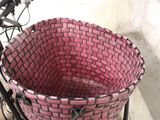 a bicycle with a basket on the back of it