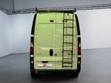 a green van with a ladder on the back of it