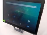 the tablet is sitting on a stand on a white surface