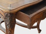 a wooden table with a drawer on top of it