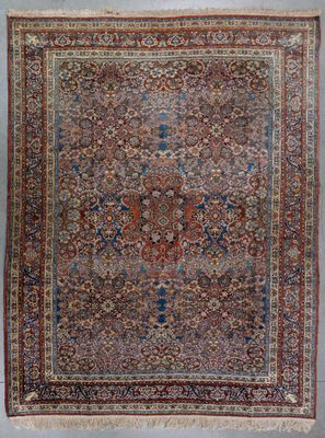 an antique persian rug with a floral design