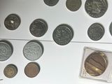 a lot of coins and a card on a table