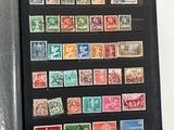 a lot of different stamps on a black book