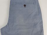 a close up of a pair of blue pants on a white surface