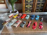 a lot of toy cars that are sitting on a table