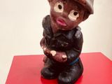 a small figurine of a fireman on a red table